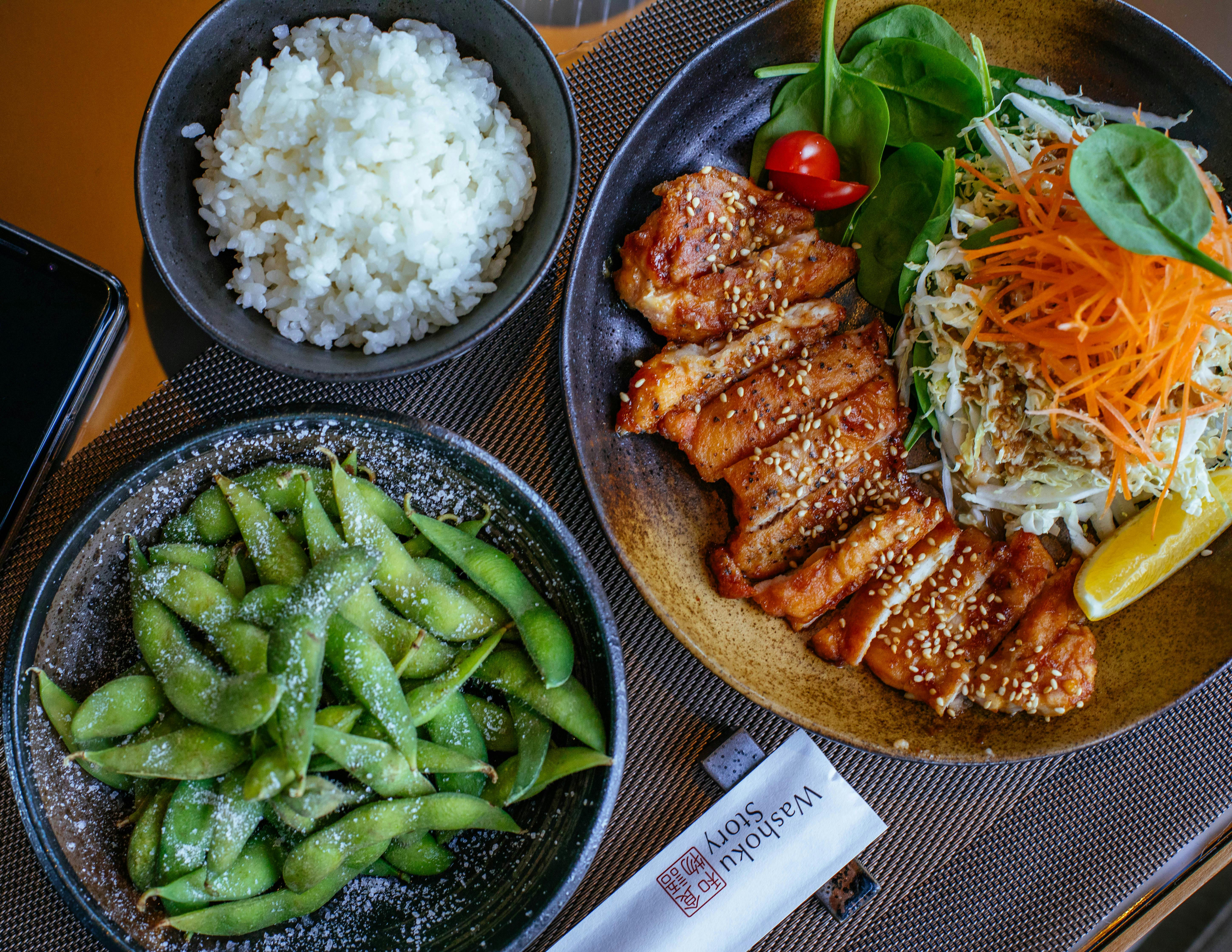 Miso glazed chicken with rice, slaw, and edamame